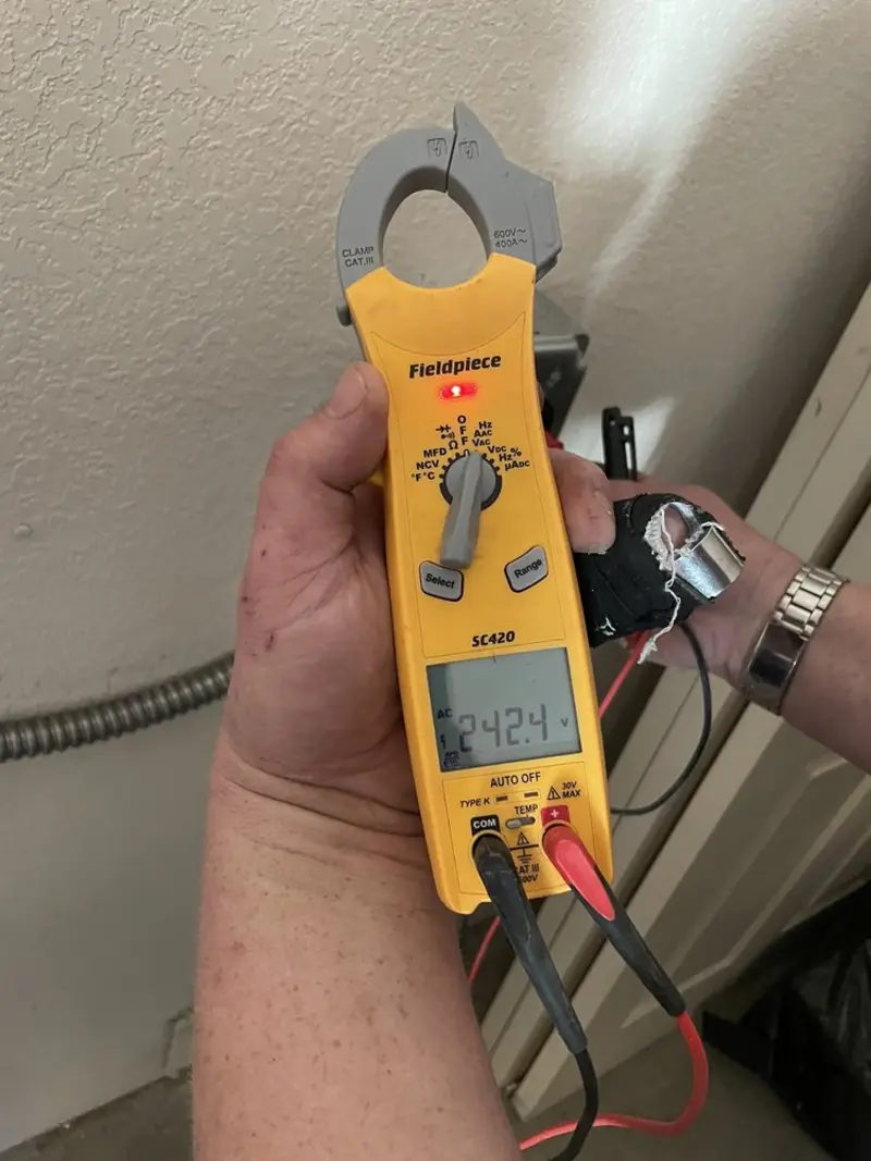 Voltage testing with clamp meter during Circuit Breaker Repair in Augusta
